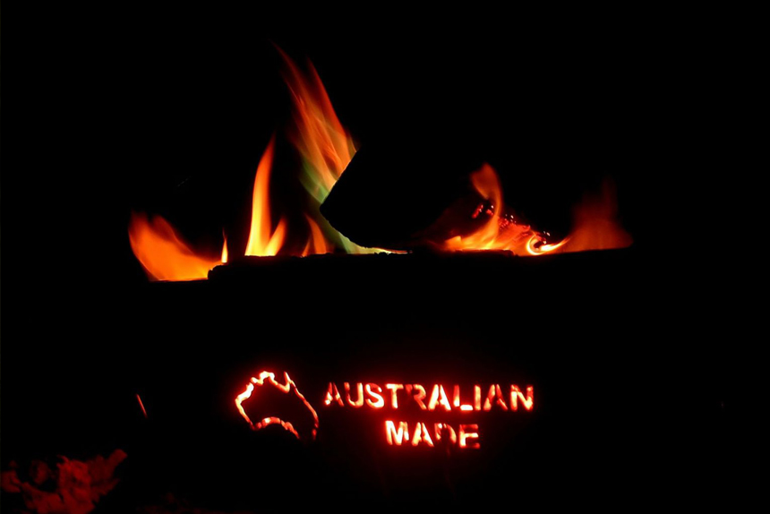 Caravans made in Australia image shows campfire with 'made in australia' cut out of the side